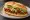 Torta de Longaniza: an illustration of refried beans, avocado, lettuce, tomato and more on bread.