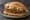 Torta de Mole: an illustration of chicken, turkey, brown sauce, refried beans and more on bread.
