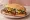 Torta de Pastor: an illustration of pork, pineapple, refried beans, onion and more on bread.