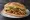 Torta de Pollo Asado: an illustration of chicken, refried beans, avocado, lettuce and more on bread.