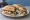 Torta de Queso con Rajas: an illustration of onion, sour cream and refried beans on bread.
