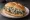 Torta de Rajas con Crema: an illustration of sour cream, onion, queso fresco and beans on bread.