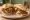 Torta Gringa: an illustration of pork, cheese, pineapple, onion and more on bread.