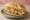 Torta Hawaiana: an illustration of ham, pineapple, cheese, beans and more on bread.