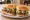 Torta (Tex-Mex): an illustration of beef, beans, avocado, lettuce and more on telera roll.