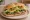 Torta Vegetariana: an illustration of beans, avocado, cheese, lettuce and more on bread.