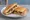 Tost z Pieczarkami: an illustration of mushroom, cheese and butter.