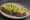 Tostada de Aguacate: an illustration of avocado, olive oil and pepper on baguette.