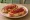 Tostadas con Dulce: an illustration of jam and butter on baguette.