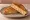 Tosti Ham-Kaas: an illustration of ham, cheese and butter.