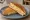 Tosti Hawaï: an illustration of ham, cheese, pineapple and butter.