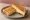 Tosti Kaas: an illustration of cheese and butter.