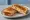 Tosti Kip: an illustration of chicken, cheese and butter.