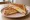 Tosti met Ei: an illustration of ham, egg, cheese and butter.