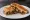 Tosti Shoarma: an illustration of cheese, onion and butter.