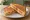 Tosti Tomaat-Kaas: an illustration of cheese, tomato and butter.