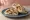Toum (توم): an illustration of chicken, garlic, lemon and olive oil on pita.