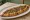 Trabzon Pidesi: an illustration of beef, onion, parsley and butter on pita.