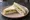 Tramezzino al Pollo: an illustration of chicken, mayonnaise, lettuce and lemon on white bread.