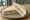 Tramezzino al Prosciutto Cotto: an illustration of prosciutto, mayonnaise and lettuce on white bread.