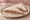 Tramezzino al Roast Beef: an illustration of beef, mayonnaise, parsley and caper on white bread.