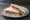 Tramezzino allo Speck: an illustration of speck and butter on white bread.