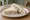 Tramezzino Gorgonzola e Noci: an illustration of walnuts and butter on white bread.