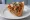 Trapizzino con Trippa alla Romana: an illustration of tomato, mint and parmesan.