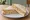 Tuna and Sweetcorn: an illustration of tuna, corn and mayonnaise on white bread.