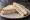 Tuna Salad Sandwich: an illustration of tuna, mayonnaise, celery, onion and more on white bread.