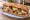 Tunisian Sandwich (כריך טוניסאי): an illustration of tuna, harissa, caper, olives and more on baguette.