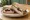 Turkey and Cranberry: an illustration of turkey, cranberry sauce, mayonnaise and brie on white bread.