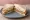 Turkey and Stuffing: an illustration of turkey, stuffing, onion, butter and more on white bread.