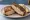 Turkey Rachel: an illustration of turkey, swiss cheese, coleslaw, russian dressing and more on rye bread.