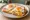 Uitsmijter Ham-Kaas: an illustration of ham, cheese, egg and butter.