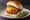 Vada Pav: an illustration of potato, cilantro, mint, pepper and more on bread.