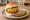 Vada Pav with Fried Chili: an illustration of pepper and potato on bread.
