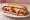 Veal Parm Hero: an illustration of mozzarella, marinara and parmesan on hoagie roll.