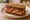 Veda Sandwich: an illustration of butter and bacon.