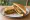 Veg Tikki Sandwich: an illustration of potato, onion and cilantro on white bread.