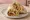 Vegan Dürüm: an illustration of mock meat, lettuce, tomato and onion on pita.
