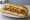 Vegetable Hoagie: an illustration of provolone, lettuce, bell pepper, olive oil and more on hoagie roll.