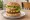 Veggie Burger (California Style): an illustration of avocado, sprouts, lettuce and tomato on burger bun.