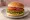 Veggieburger: an illustration of lettuce, tomato and onion on burger bun.