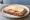 Vollkornbrot Sandwich: an illustration of butter, cheese and ham.