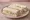 Walnut and Celery: an illustration of walnuts, celery, cream cheese and lemon on white bread.