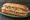 Wawa Classic Hoagie: an illustration of ham, salami, provolone, lettuce and more on hoagie roll.