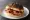 Well-Fired Roll: an illustration of bacon, butter and brown sauce.