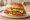 Wendy's Spicy Chicken Sandwich: an illustration of chicken, cayenne, paprika, lettuce and more on burger bun.