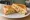 Western/Denver Sandwich: an illustration of egg, ham, onion, bell pepper and more on white bread.